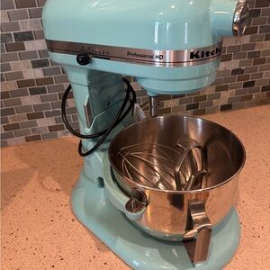 Professional HD KitchenAid stand mixer with attachments.